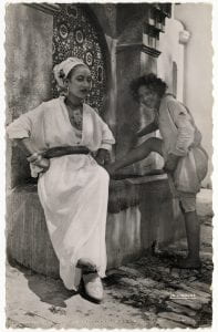 Postcard No. 95.001.92 from a French Series, Scenes and Types: Beside the Fountain, Photograph, Pre-1956, Printed by La Cigogne Publishers in Casablanca, Morocco.